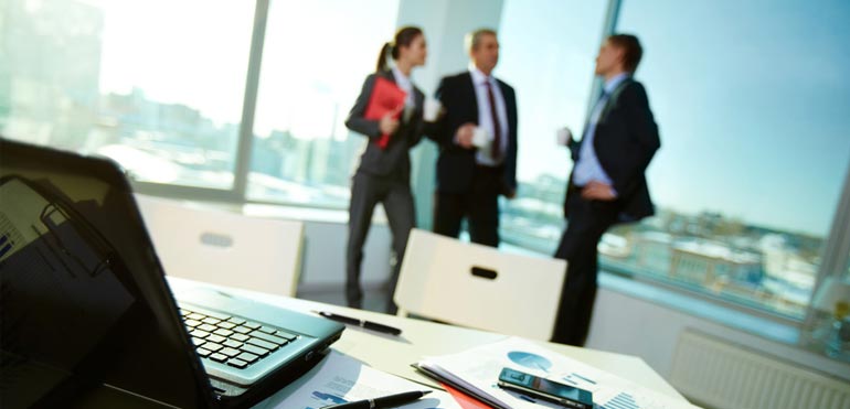 Kirtley Qureshi & Co advisers in a meeting